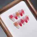 Cute Jelly handmade press-on nails with trendy floral design displayed on a white background.